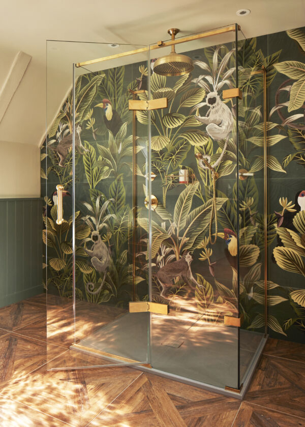 a shower with jungle wallpaper