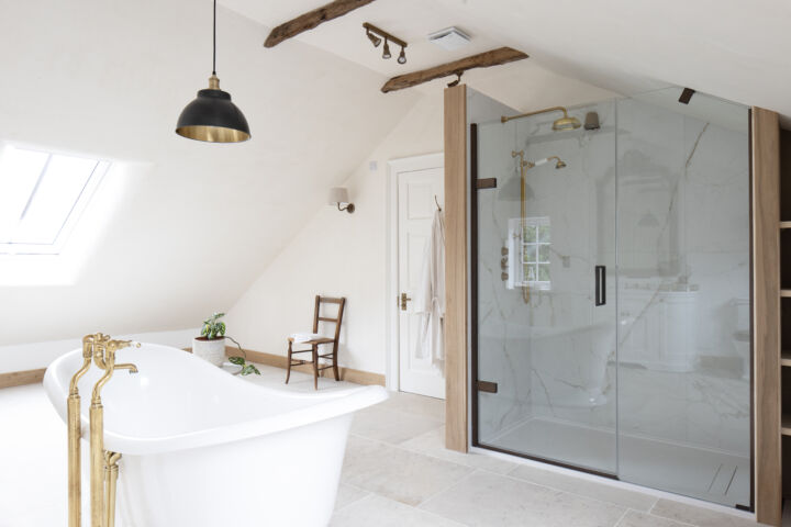 a bathroom with a glass shower and a bath tub