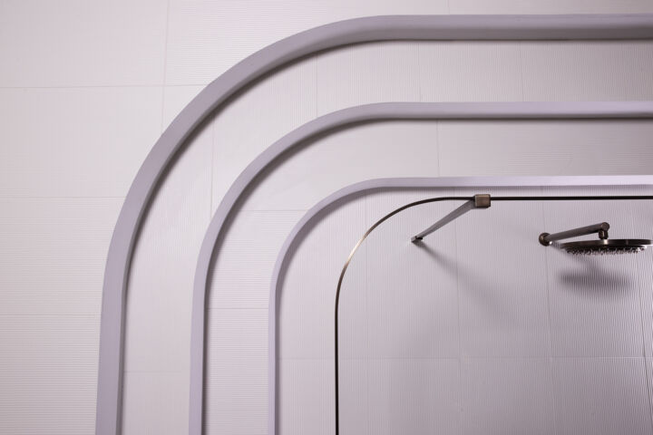a curved shower screen in a bathroom
