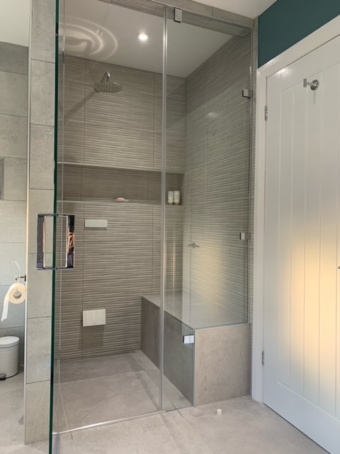 a shower with glass doors