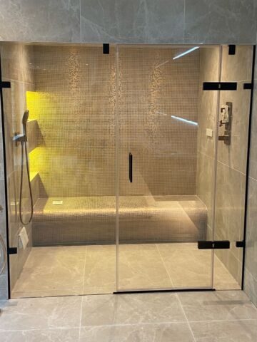 a glass shower steam room