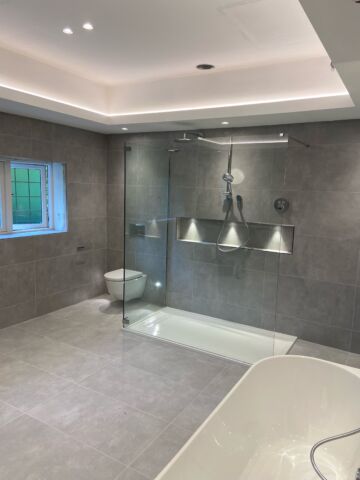 a bathroom with a large glass shower