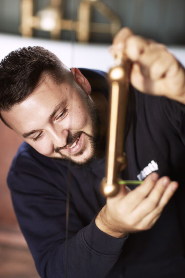 a man fitting a shower door handle