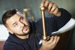 a man holding a shower door handle