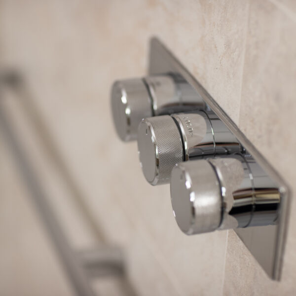 a close up of a shower mixer tap
