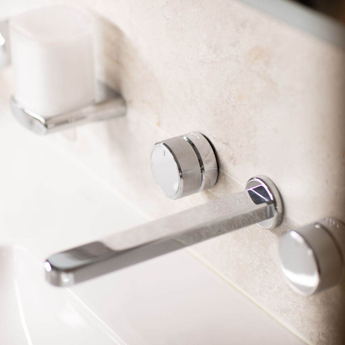 a chrome basin tap and mixers