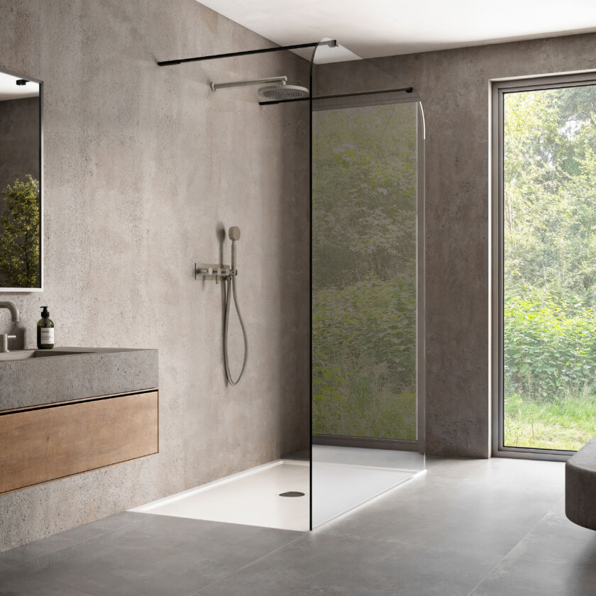 a wet room with a glass shower screen